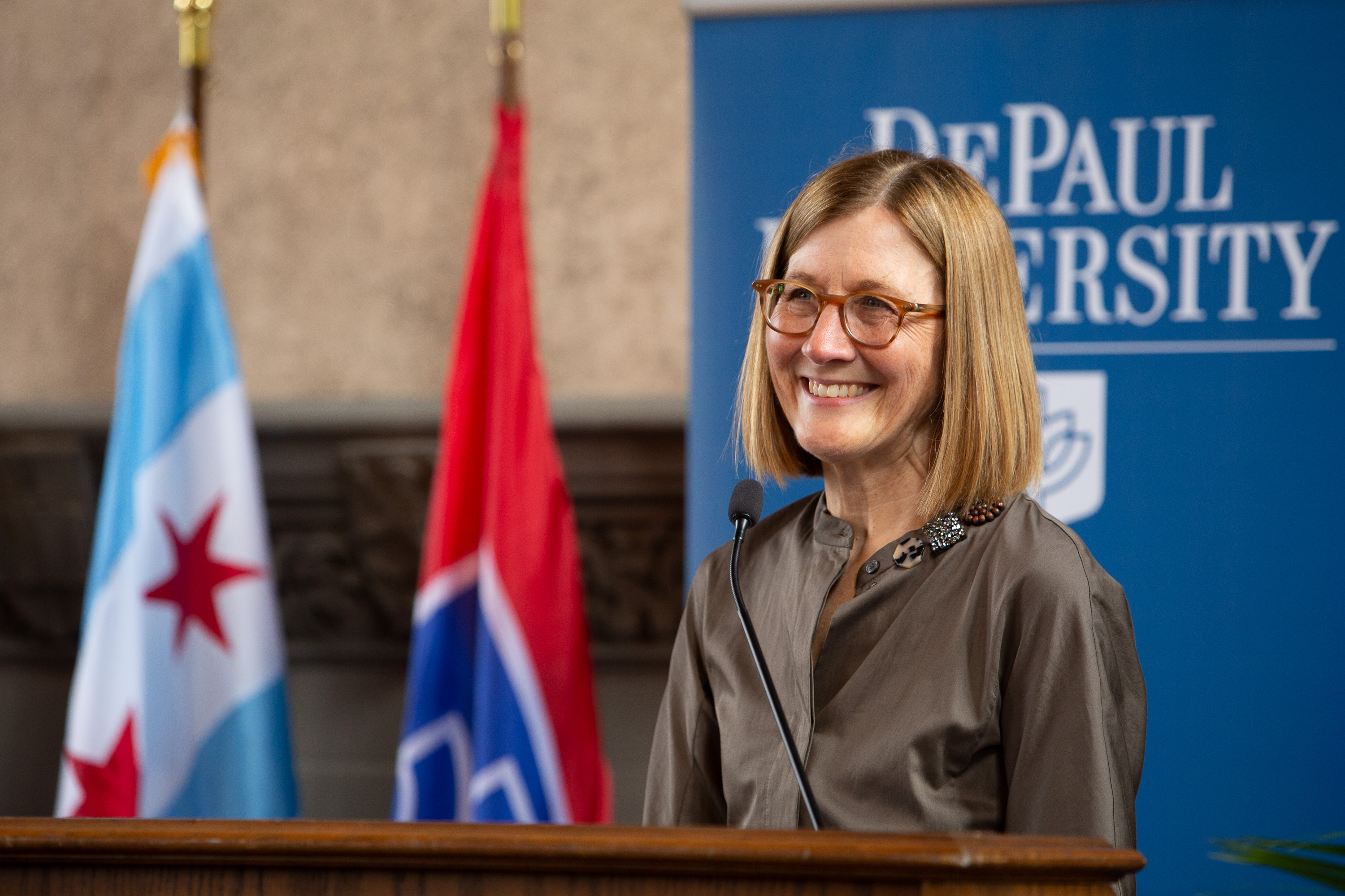 Judy Greffin, chair for the Presidential Search Committee and vice-chair for the Board of Trustees, welcomed attendees to Cortelyou Commons and the livestream. (DePaul University/Randall Spriggs)